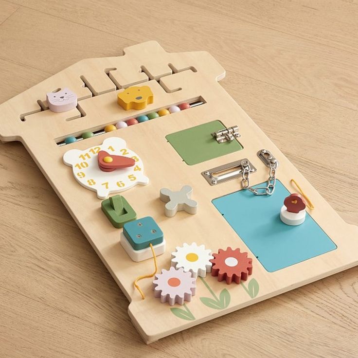 a wooden toy board with magnets and other items on it's back side