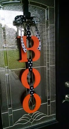 the door is decorated with an orange ribbon and polka dots