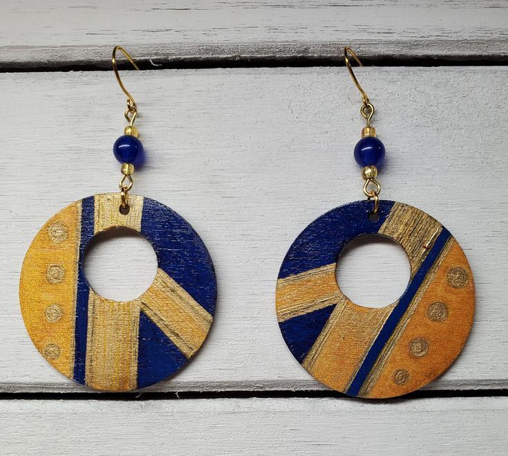 Have you been invited to a hoity toity party lately? These earrings may be the perfect one-of-a-kind earrings to strut your stuff. These blue and gold earrings would add a classy touch to any outfit (even for those of you who prefer jeans and sweats, like me :-) )  The circles are 1-1/2 inch in diameter. The backs also feature a similar artistic design, so you'll look great coming and going. :-). Add some fun! Enjoy yourself at whatever party you attend! :-) Hand Painted Gold Earrings For Party, Party Hand Painted Gold Earrings, Gold Hand Painted Earrings For Party, Unique Blue Hoop Earrings For Gift, Unique Blue Hoop Earrings As Gift, Art Earrings, Earring Trends, Free Earrings, Earring Crafts