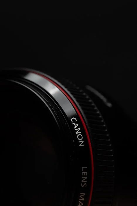 a canon lens sitting on top of a table