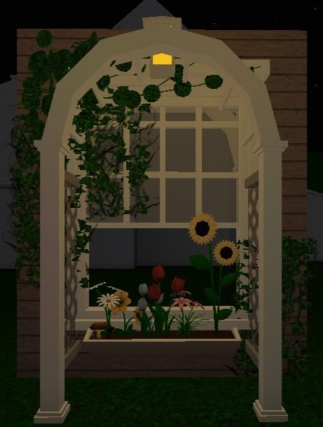 an animated image of a garden with sunflowers and other flowers in the night