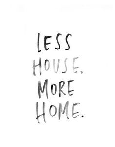 the words less house, more home are written in black ink on a white background