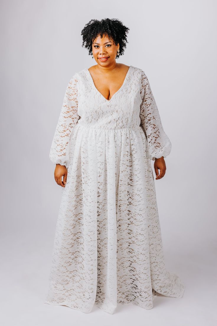 The Rue Gown is perfect for the boho bride. This gown features: V neckline and back made from soft boho-inspired lace, lined with matte satin with supportive boning Flowy, gathered skirt made from soft boho-inspired lace, lined with a matte satin a-line circle skirt Optional fitted sleeves or bishop sleeves with elastic cuffs, available as detachable or permanently attached sleeves Optional small train Center back zipper closure or optional corset back Customize this dress to make it yours by ch V-neck Gown With Lace Bodice, Lace Gown With Fitted Bodice And V-neck, Floor-length Lace Wedding Dress With Lace Bodice, Fitted Lace Maxi Dress With Lace Back, Wedding Lace Dress With Fitted Bodice And Maxi Length, Lace Maxi Dress With Lace Sleeves For Wedding, V-neck Delicate Lace Maxi Dress For Wedding, Wedding Maxi Dress With Lace Back, Lace Maxi Dress With Lace Back For Wedding