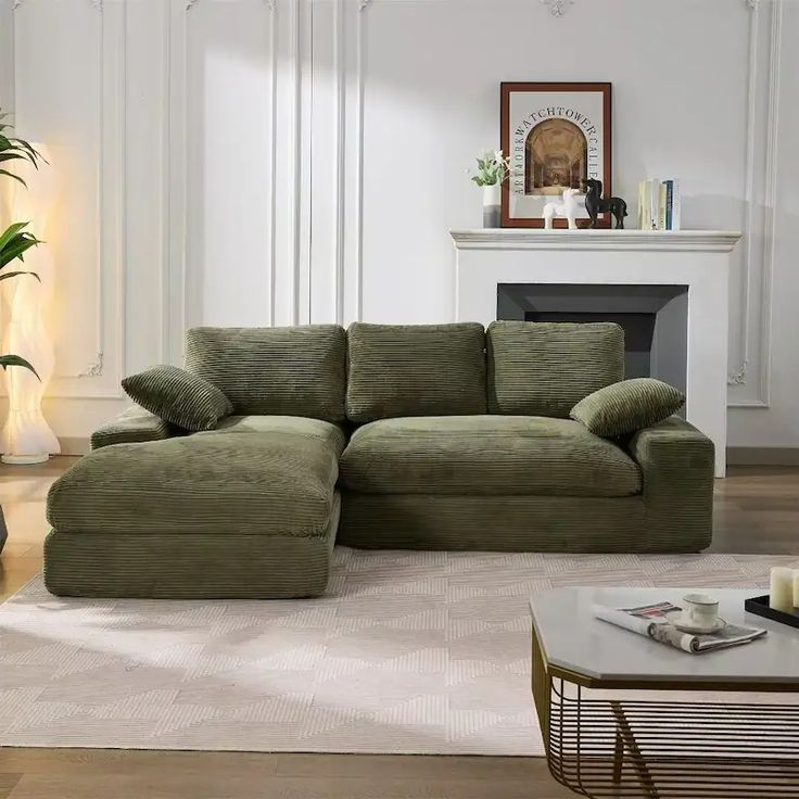 a living room with a large green couch