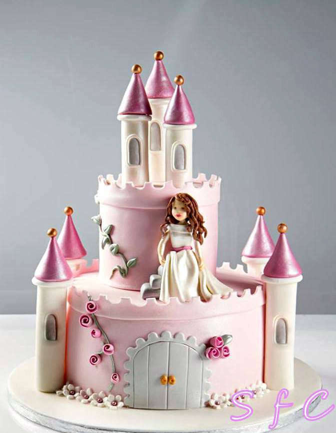 a pink princess castle cake with white frosting