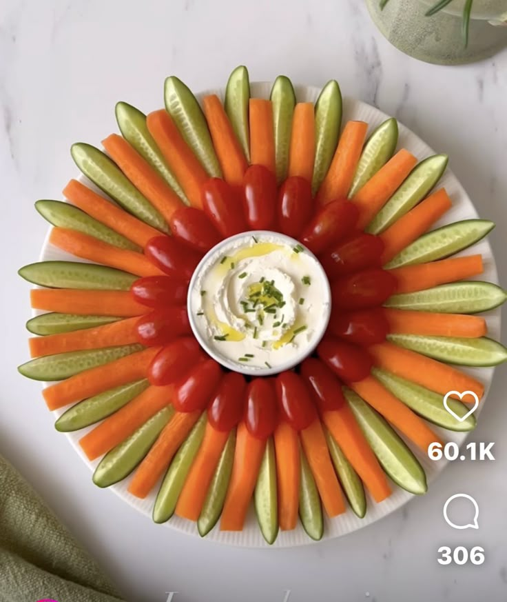 a white plate topped with carrots and celery sticks