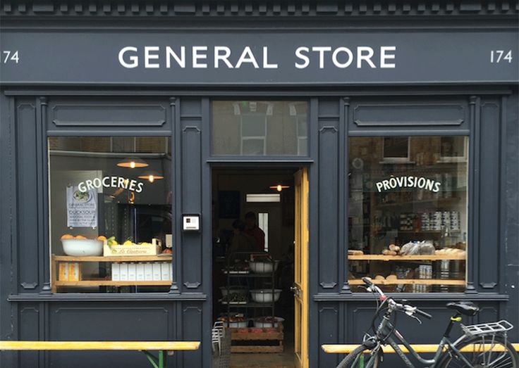 a bike is parked in front of a store