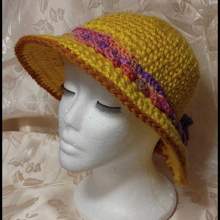 Stylish And Versatile Hand Crafted Hat Can Be Worn As A Fedora, Bucket, Bowler, Panama Hat And More With Sides Up Or Down Large Blooming Flowers Accent At The Back Where Wide Brim Separates Variegated Colors Lacy Band Nwot, Never Worn One Of A Kind Handmade From 100% Acrylic Chunky Yarn 20" Around Crown 2.5" Brim Versatile, Wear Brim Folded Or Down In Many Ways Hand Washable Smoke Free / Pet Free Environment Multicolor Brimmed Cloche Hat, Fitted Yarn Beach Hat, Yellow Adjustable Crochet Hat For Spring, Adjustable Yellow Crochet Hat For Spring, Spring Adjustable Yellow Crochet Hat, Pink Cloche Hat For Spring Beach, Pink Cloche Hat For Spring Beach Outings, Yellow Crochet Hat For Spring, Pink Cloche Hat For Beach In Spring