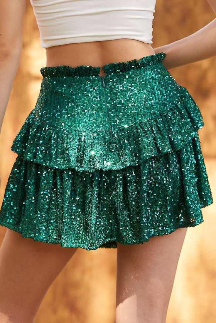 Get ready to shine in this fully sequin Hunter Green skort! Perfect for any occasion, from Christmas to Mardi Gras to game day. Show off your unique style with this playful and versatile ruffle skort. 95% Polyester 5% Spandex Fit: This skirt is intended to be fitted with a smocked waist and relaxed fit in the hips. Waist: The waist is intended to be fitted with a stretchable smocked waist. Hips: The hips are intended to have a relaxed fit. Length: The length hits about mid thigh. Fabric: The fab Layered Mini Skirt, Tiered Mini Skirt, Black Dress Outfits, Rave Outfit, Summer Soiree, Sequin Mini Skirts, Outfits Spring, Maxi Dress Formal, Crop Top Shirts