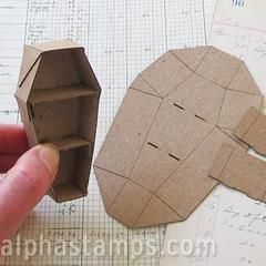 someone is making an origami elephant out of cardboard