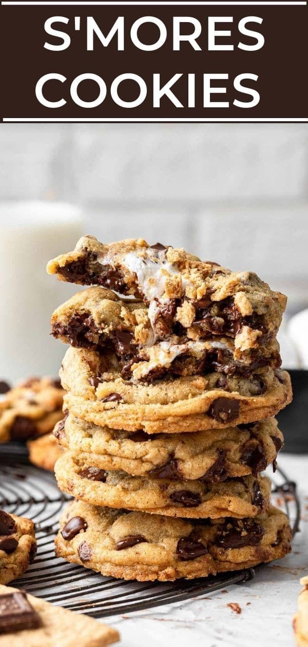 chocolate chip s'mores cookies stacked on top of each other with milk in the background