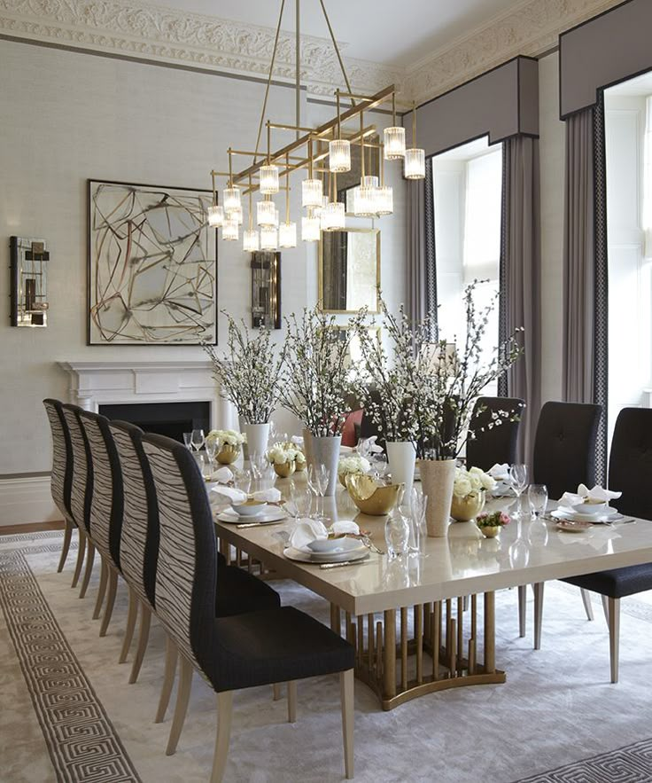 the dining room table is set with white flowers