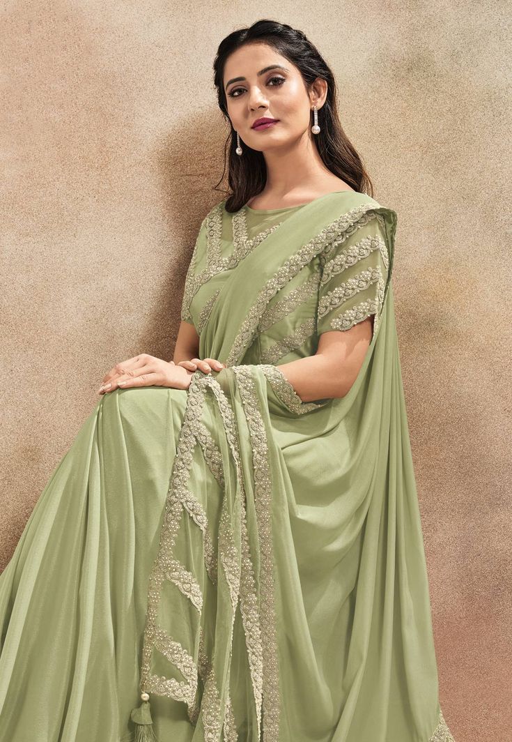 Pista green satin silk saree with blouse 42010  Desc:  Color : Pista Green Saree Fabric : Satin Silk Work : Embroidery Wash Care : Dry clean Sleeve Style : Half Sleeve Long Sleeves : Done only in Custom Stitch Sleeves Lining : Done only in Custom Stitch Bust Size : 34 to 40 Inches Occasion : Wedding   Kitty Party   Mehendi   Sangeet   Party Wear   Reception   Gudi Padwa. With Express Free Shipping and Custom Stitching, Buy Indian Party wedding wear Bridal saris Pista green satin silk saree with Half Saree Designs Simple, Pista Green Saree, Green Sari, Satin Silk Saree, Bridal Sari, Simple Lehenga, Simple Saree Designs, Indian Sari Dress, Pista Green