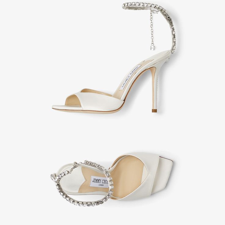 SAEDA SANDAL 100 | Ivory Satin Sandals with Crystal Embellishment | Spring 2023 collection | JIMMY CHOO Luxury Crystal Embellished Ankle Strap Sandals, Elegant White Evening Sandals, Elegant Crystal Embellished Ankle Strap Sandals, Elegant Wedding Heels With Single Toe Strap, Elegant Heels With Single Toe Strap For Wedding, Elegant White Sandals For Gala, Elegant Single Toe Strap Heels For Wedding, Elegant Single Toe Strap Sandals For Wedding, Elegant Sandals With Removable Insole For Events