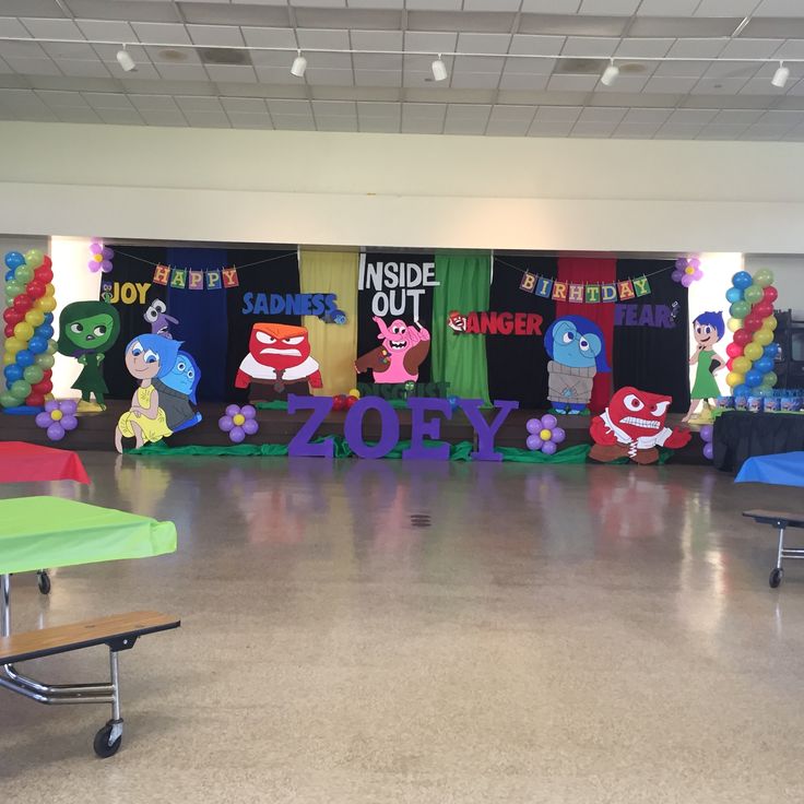 an empty classroom with chairs and decorations on the floor