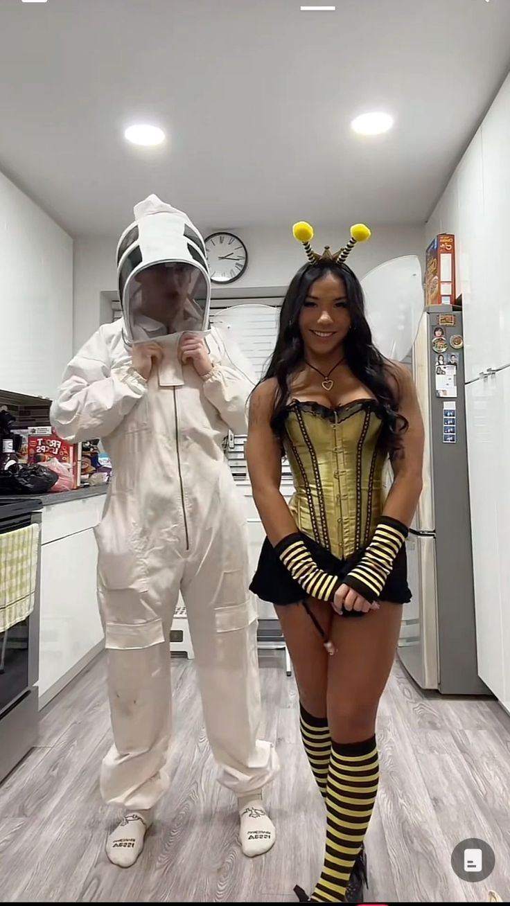 two people in costumes standing next to each other