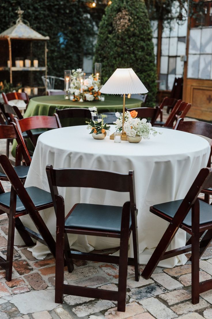 the table is set up for an outdoor dinner