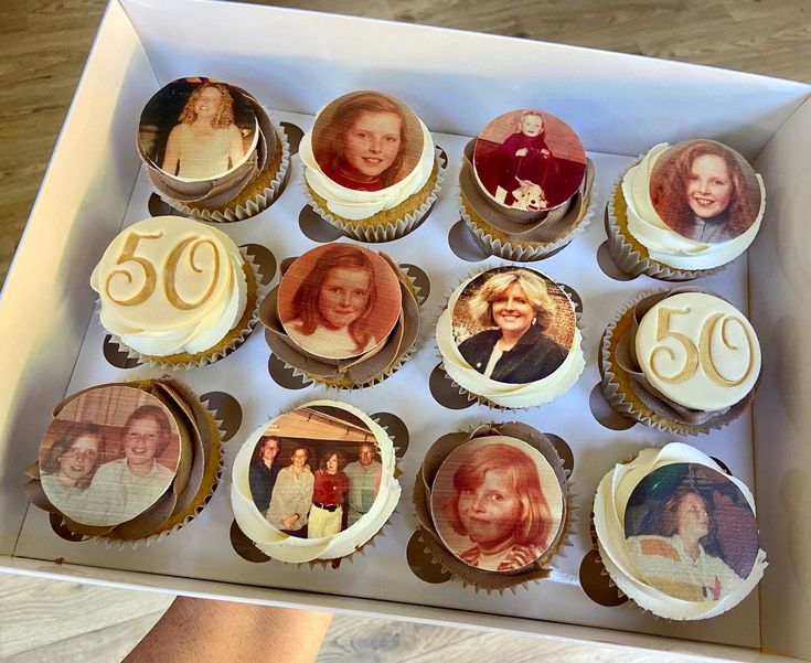 a box filled with cupcakes covered in frosting and pictures of women's faces