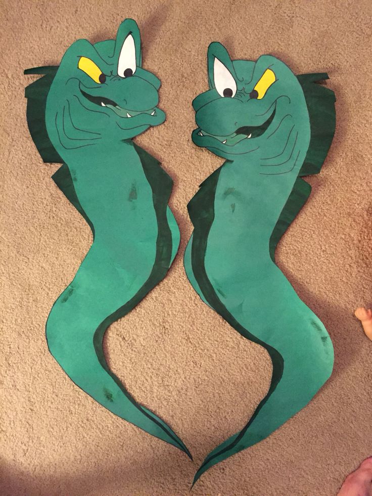 paper cut out of the shape of two seahorses