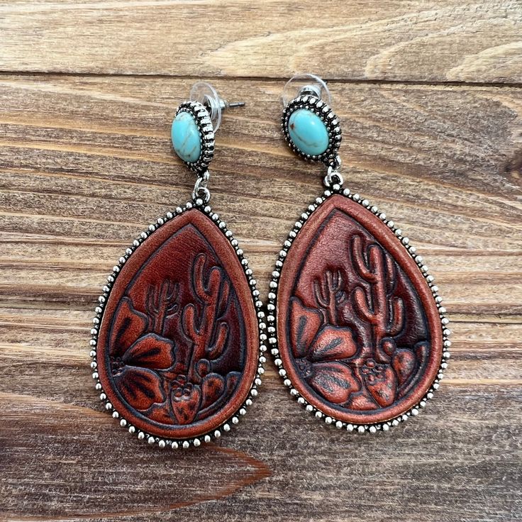 -Teardrop leather stud earrings Concho Drop Earrings, Concho Dangle Earrings For Gift, Hand Tooled Teardrop Bohemian Earrings, Bohemian Hand Tooled Teardrop Earrings, Bohemian Teardrop Hand Tooled Earrings, Adjustable Teardrop Plug Earrings For Pierced Ears, Trendy Nickel-free Brown Jewelry, Trendy Teardrop Jewelry With Matching Earrings, Hand Tooled Teardrop Earrings For Gift