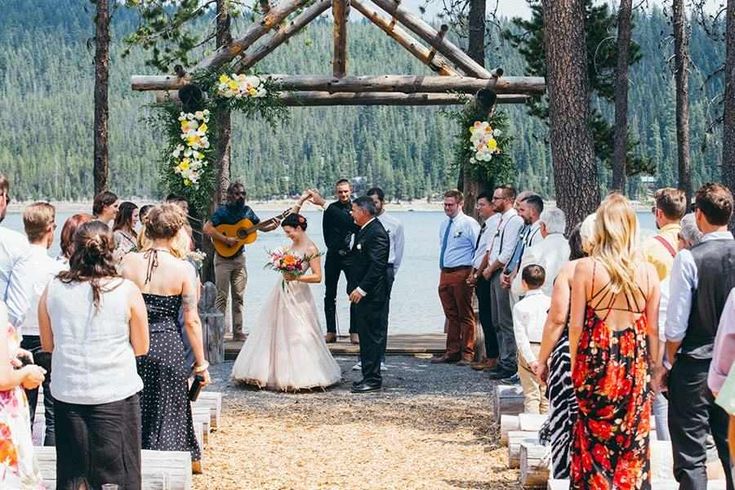 a couple getting married at the end of their wedding ceremony