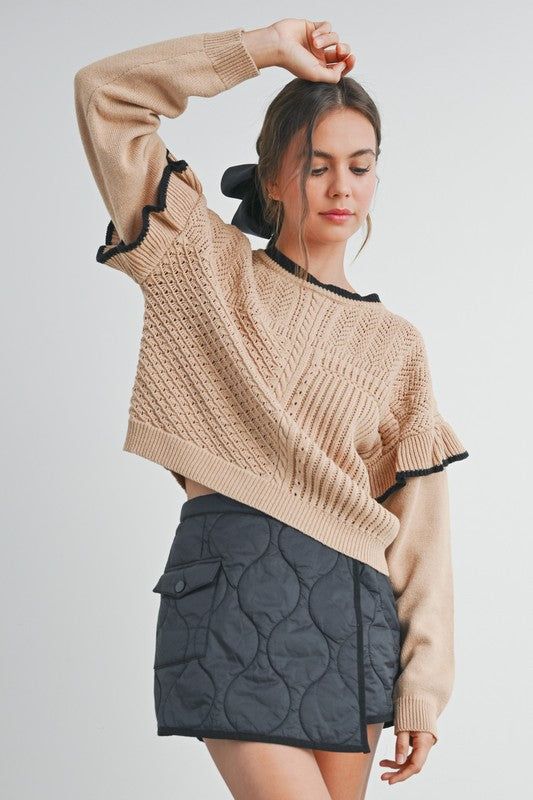 Elevate your style with our Ruffled Shoulder Knitted Sweater. Crafted from a soft, cozy knit, this sweater features charming ruffled shoulders that add a touch of femininity and flair. Perfect for both casual outings and dressier occasions, it pairs beautifully with jeans or skirts. Available in a range of versatile colors, this sweater is a must-have addition to your wardrobe for a chic, effortless look. Chic Beige Cropped Sweater For Spring, Chic Stretch Cropped Sweater In Soft Knit, Chic Chunky Knit Cropped Sweater For Layering, Chic Long Sleeve Sweater With Ruffles, Chic Knit Cropped Sweater For Spring, Chic Chunky Knit Cropped Sweater For Fall, Chic Stretch Knit Cropped Sweater, Beige Stretch Chic Cropped Sweater, Chic Beige Stretch Cropped Sweater