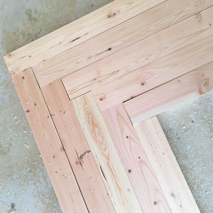 three pieces of wood sitting on top of each other in the middle of a floor