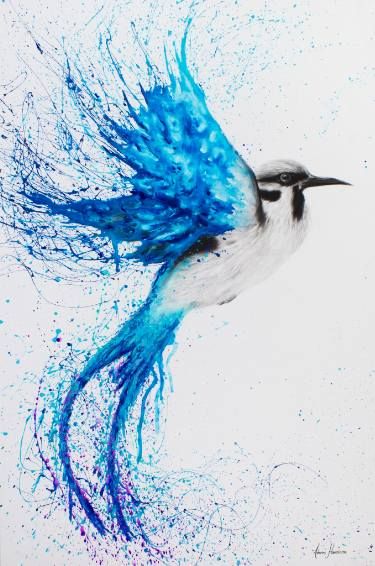 a blue and white bird with feathers flying through the air, splattered with paint