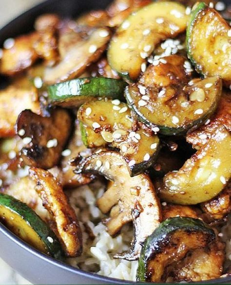 a bowl filled with fried vegetables and rice