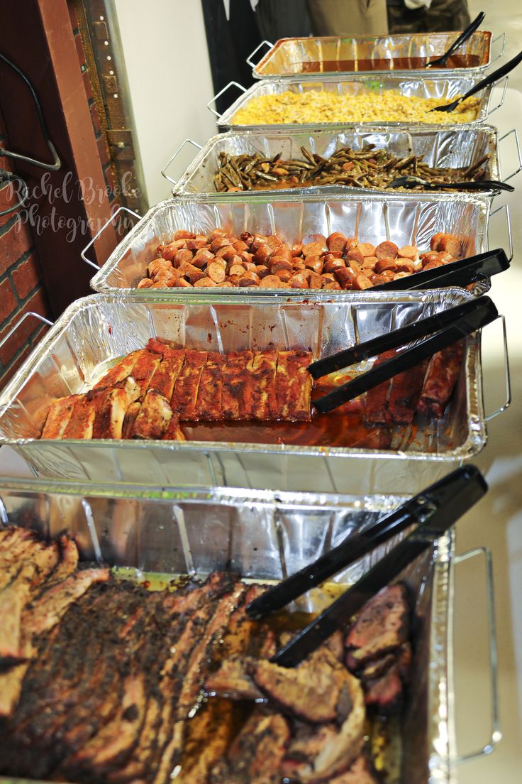 several trays filled with different types of food