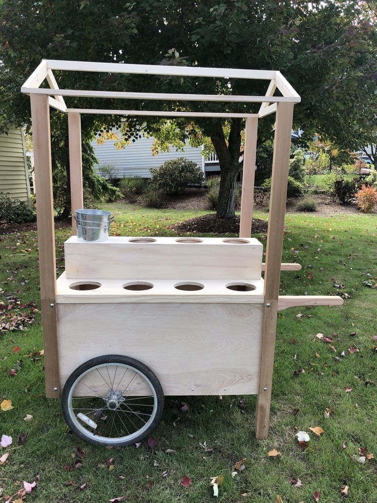 a cart made out of wood with wheels