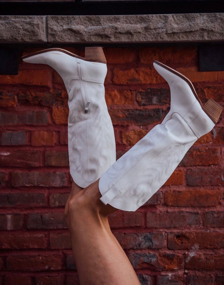 The hottest trend of 2022 are white boots no doubt and these fit the bill. Man made upper. Leather wrapped heel. Shaft height is 13.75". Heel height is 2.5". Half zip closure. Boot opening is 15" circumference. Running true to size. If you toggle between two sizes, go with your larger size. Casual White Leather Knee-high Boots, Trendy White Knee-high Boots, White Wide Calf Knee-high Heeled Boots, White Knee-high Boots For Fall, White Knee-high Boots For Spring, White Western Heeled Boots With Wide Calf, Western White Heeled Boots Wide Calf, White Western Wide Calf Heeled Boots, White Western Heeled Boots For Wide Calves