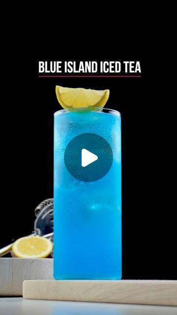 a blue island iced tea with lemon wedges