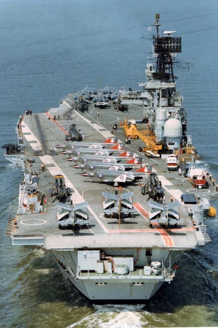 an aircraft carrier is shown in the water