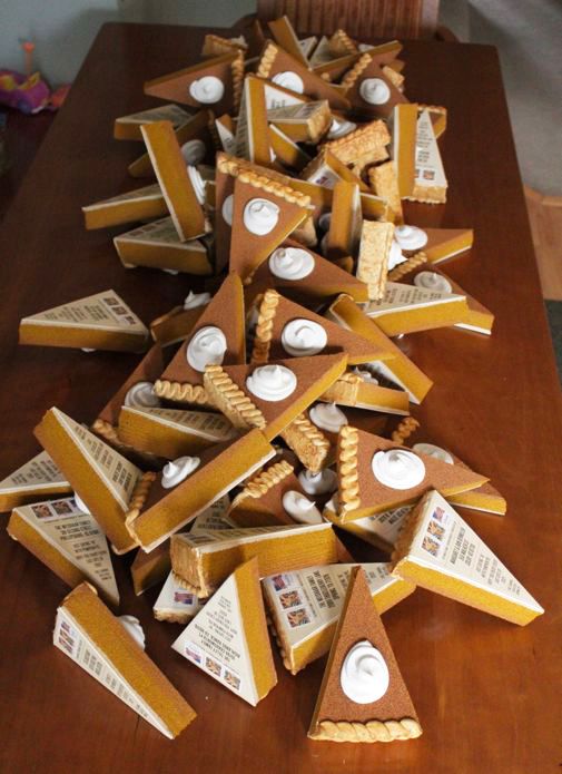 several pieces of pie sitting on top of a wooden table