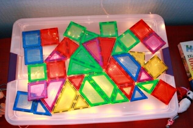 a plastic tray filled with lots of different colored blocks