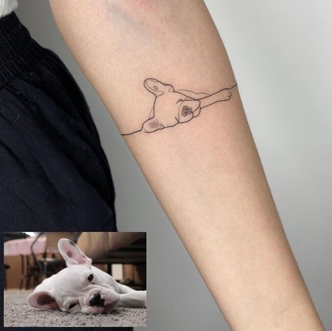 a small rabbit tattoo on the arm