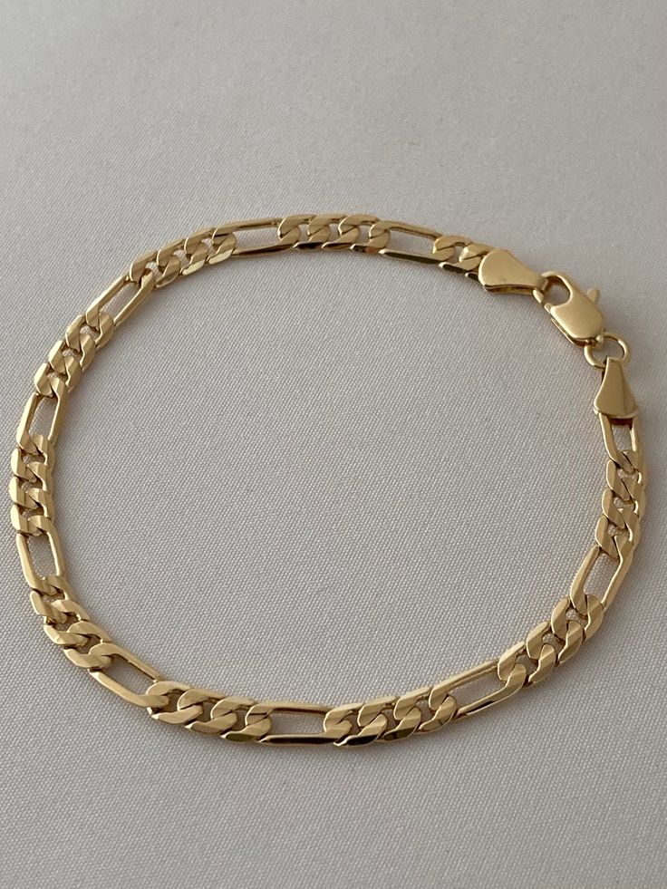 The Figaro Bracelet is an icon whose stood the test of time! This thin gold bracelet is the OG of the chain world and still holds its place as #1. It satisfied the need for a classic mens figaro bracelet and womens too. Is there anything this bracelet can't do? Available in 24K gold or rhodium plating over steel Patent plating & sealant technology to ensure durability and long lasting wear Made in Los Angeles, CA | Nickel & Lead Free Figaro Bracelet, Dainty Gold Bracelet, Everyday Bracelet, Solid Gold Chains, Figaro Chains, Figaro Chain, Pretty Bracelets, Beautiful Love, Chain Bracelet