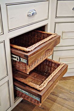 two wicker baskets are stacked on top of each other in this kitchen cabinet drawer