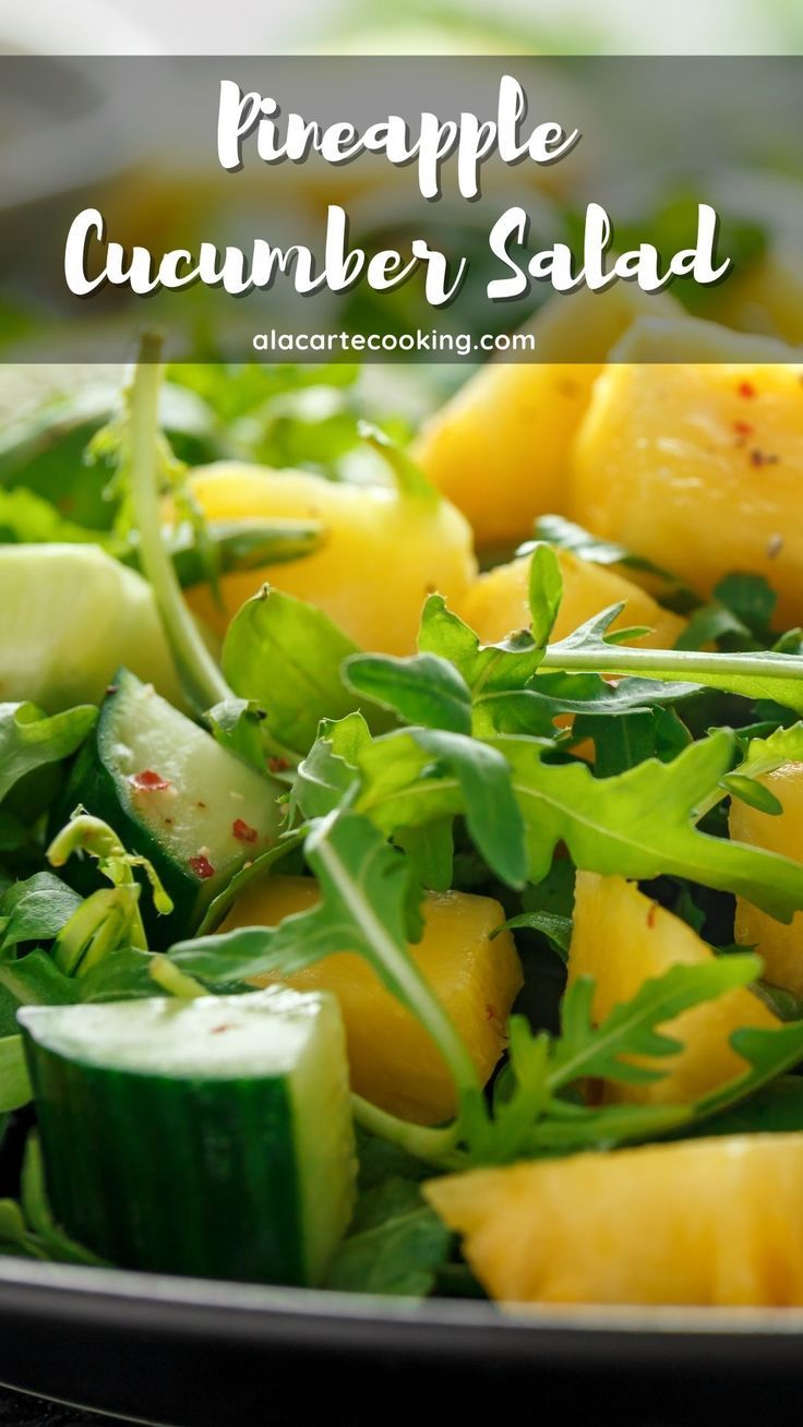 pineapple and cucumber salad in a black bowl with text overlay that reads pineapple cucumber salad