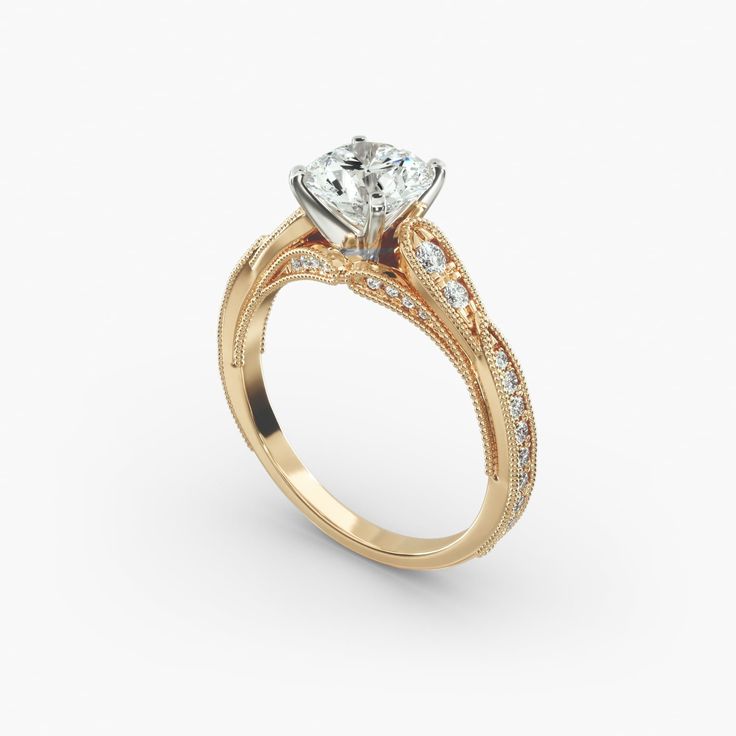 a yellow gold engagement ring with an oval diamond center and side stones on the band