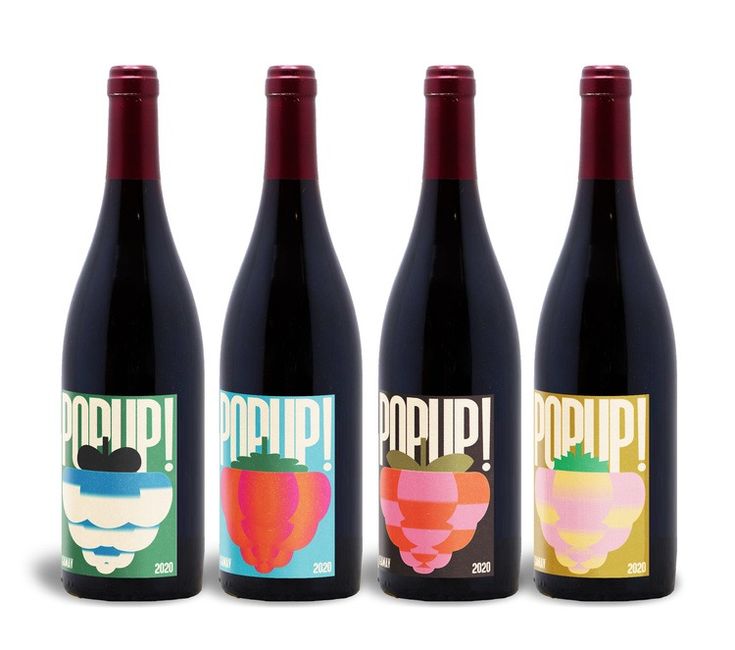 three bottles of wine with different designs on them