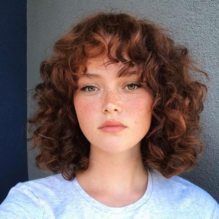 21 Trendiest Long Shaggy Bob Haircuts for Carefree Women Round Face Hairstyles Curly Hair, Short Curly Hair With Wispy Bangs, Short Brown Curly Hair With Bangs, Plus Size Fringe Hair, Short Curly Hair With Round Face, Curly Hair Short With Bangs, Curly Hair With Round Face, Short Curly Haircuts With Bangs Round Faces, Short Curly Hair Bangs Round Face