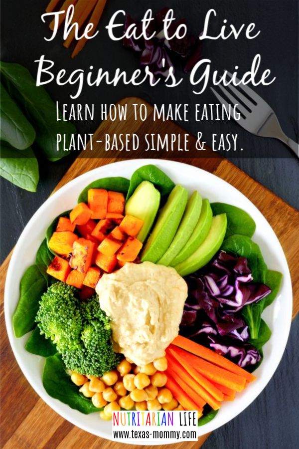 a white bowl filled with vegetables and veggies on top of a wooden cutting board