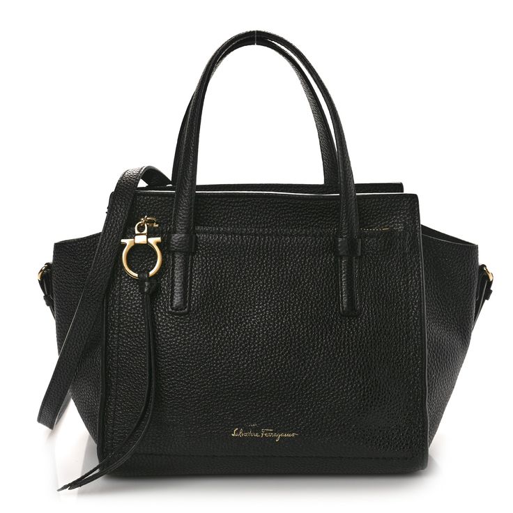 This is an authentic SALVATORE FERRAGAMO Hammered Calfskin Double Handle Small Amy Tote in Black. This chic small shoulder bag is finely crafted of hammered black calfskin leather. The bag features a front zipper pocket, looping leather handles, and a removable shoulder strap. The top is open to a black leather interior with a zipper pocket. Salvatore Ferragamo Bags, Small Shoulder Bag, Leather Handles, Leather Interior, Leather Handle, Salvatore Ferragamo, Front Zipper, Calf Skin, Zipper Pocket