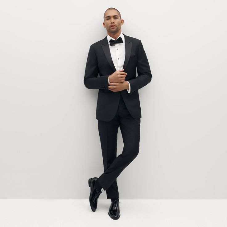 Elegant Fitted Suit For Formal Occasions, Dapper Tailored Tuxedo For Work, Formal Tuxedo Suit With Pressed Crease, Tailored Formal Tuxedo, Tailored Elegant Tuxedo For Formal Occasions, Tailored Elegant Tuxedo For Formal Events, Elegant Tailored Tuxedo For Formal Occasions, Elegant Tailored Tuxedo For Formal Events, Tailored Tuxedo In Suiting Fabric For Formal Occasions