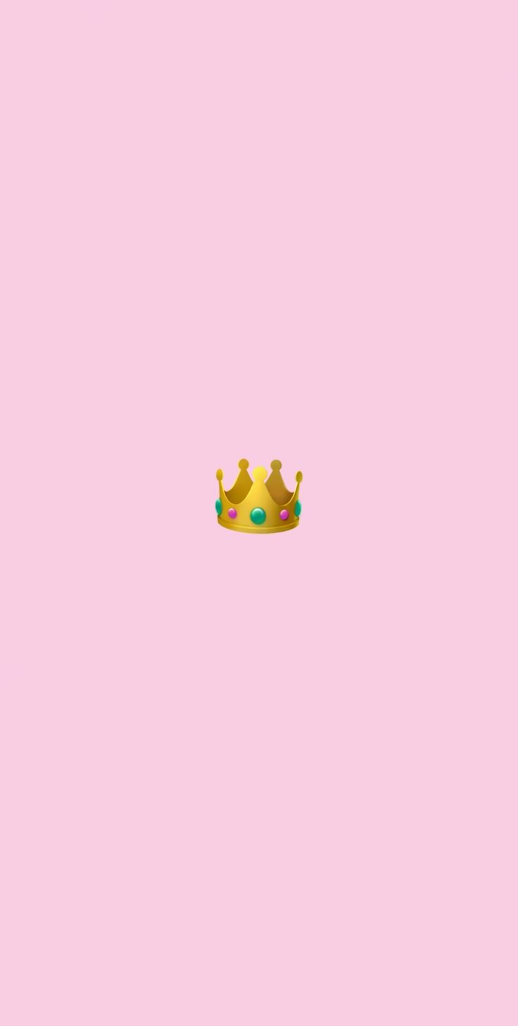 a pink wall with a crown on it