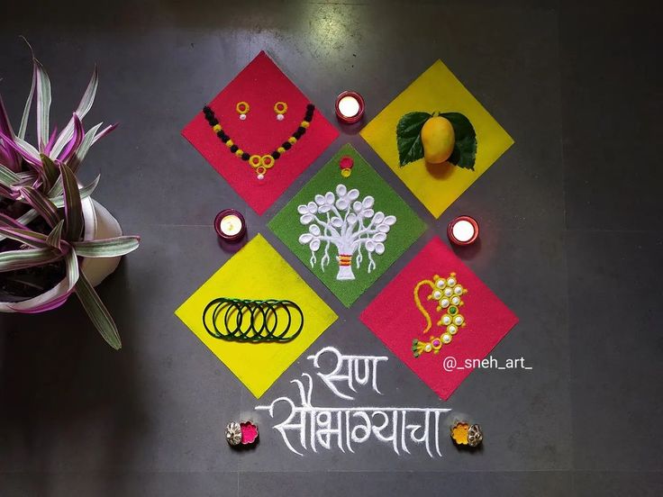 a decorated table with candles and flowers on it in front of a sign that says happy diwali