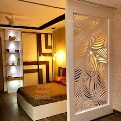 a bed room with a neatly made bed next to a book shelf and shelves on the wall