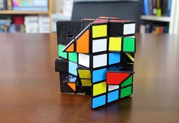 a rubik cube sitting on top of a wooden table